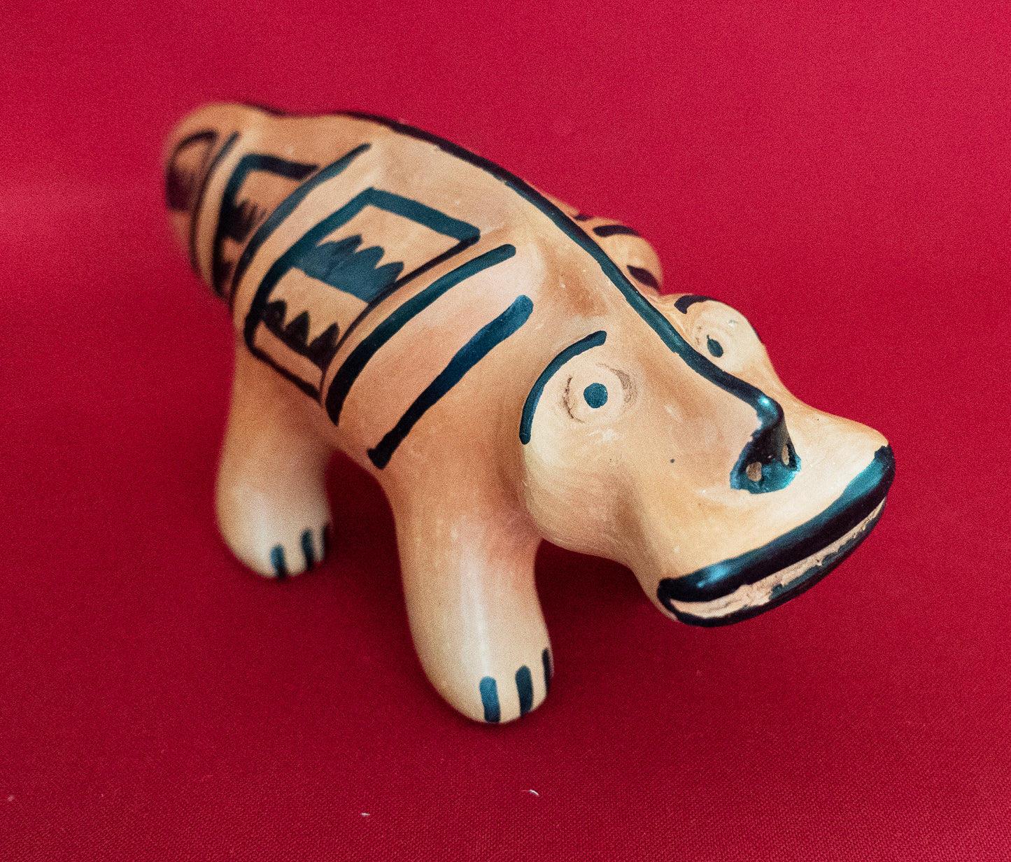 Orange Canoe Snake (Ela Chama Kamaluhai) by Indigenous artisans of Upper Xingu Territory